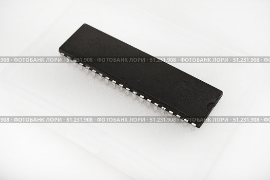 The chip is in a plastic package. An old chip. Стоковое фото, фотограф Valeriy Lushchikov / Фотобанк Лори