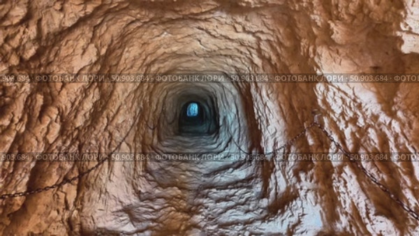 The Enigmatic View of the Underground Tunnel Awaits the Adventurous Explorers Gaze. Стоковое видео, видеограф Vladimir Vintonjak / Фотобанк Лори