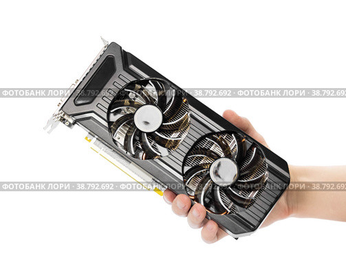 The hand holds a powerful video card with two fans. Close up. Isolated on a white background. Стоковое фото, фотограф Плотников Дмитрий / Фотобанк Лори