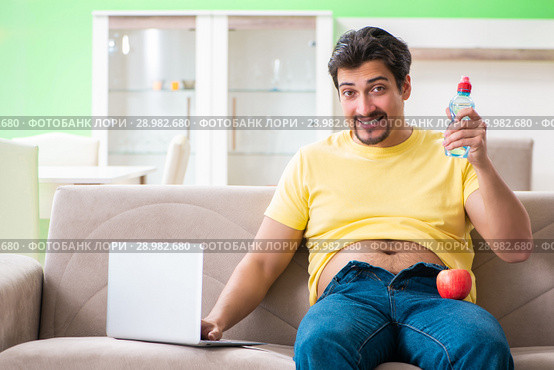 The man suffering from extra kilos in dieting concept. Стоковое фото, фотограф Elnur / Фотобанк Лори