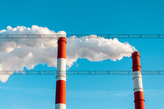 The pipe of the thermal power plant on the background of the blue sky. The concept of ecology and environmental protection. Стоковое фото, фотограф Ярославский Максим / Фотобанк Лори