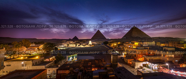The Pyramids and the Sphinx in the night lights, Giza, Egypt. Стоковое фото, агентство Ingram Publishing / Фотобанк Лори