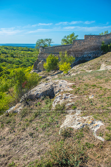 The remains of a medieval fortress city (according to other sources - a monastery) Tepe-Kermen, covering the upper part of the mountain in several tiers (2020 год). Стоковое фото, фотограф Анна Кривицкая / Фотобанк Лори
