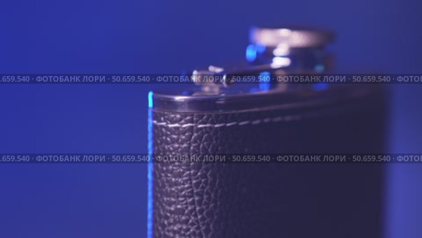 The rotation of a metal flask for alcohol. Стоковое видео, видеограф Потийко Сергей / Фотобанк Лори