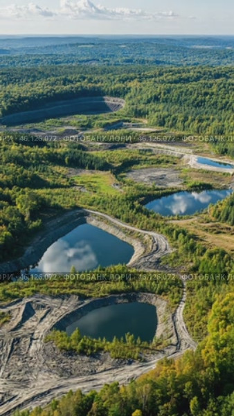 Theophrastus mine showing tailings ponds and surrounding area. Стоковое AI-видео, аниматор Юрий Поздников / Фотобанк Лори