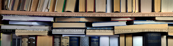 There are stacks of books on the standing books. Close-up. Panorama. Background for libraries, science, education. Стоковое фото, фотограф Бузмакова Светлана / Фотобанк Лори