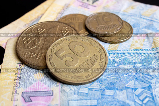 Three banknotes of Ukrainian hryvnia on a black background. Стоковое фото, фотограф Аксенова Вера / Фотобанк Лори