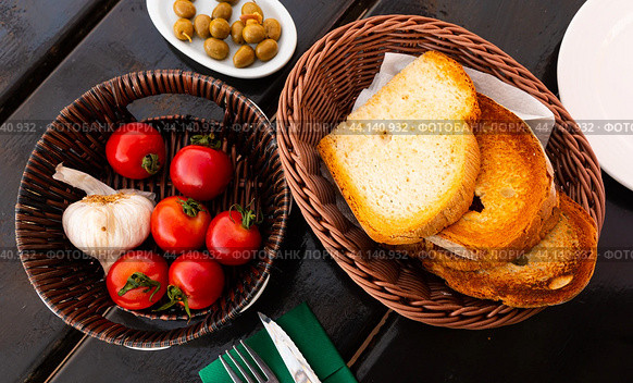 Toasted white bread, tomatoes, garlic and olives for Pan con tomate. Стоковое фото, фотограф Яков Филимонов / Фотобанк Лори
