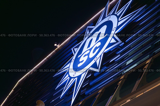 Tokyo, Japan - Oct 2 2024, panoramic view from below of the giant MSC Cruises logo located on the tube of the MSC Bellissima cruise ship, at nighttime, Tokyo, Japan. Редакционное фото, фотограф Сергей Богомяко / Фотобанк Лори