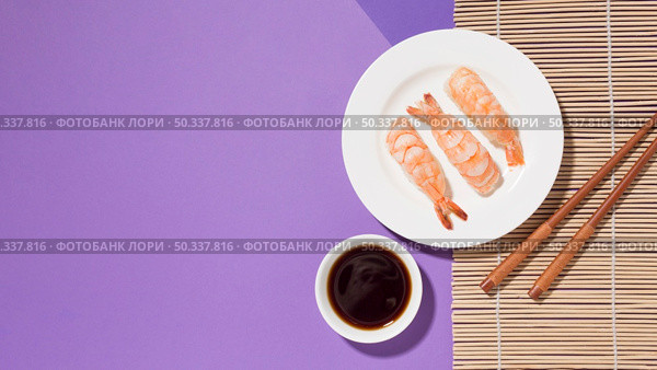 top view delicious sushi with soy sauce table. Стоковое фото, агентство Ingram Publishing / Фотобанк Лори