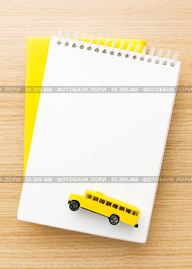 top view notebooks with school bus. Стоковое фото, агентство Ingram Publishing / Фотобанк Лори