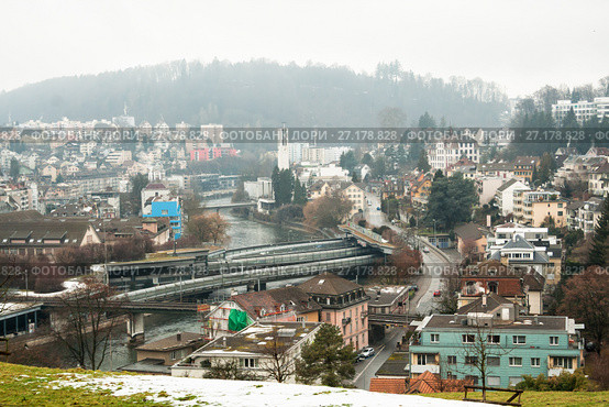 Top view of residential areas in Lucerne on a foggy winter day, Switzerland (2010 год). Стоковое фото, фотограф Юлия Бабкина / Фотобанк Лори