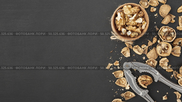 top view walnuts with cracker copy space. Resolution and high quality beautiful photo. top view walnuts with cracker copy space. High quality and resolution beautiful photo concept. Стоковое фото, агентство Ingram Publishing / Фотобанк Лори