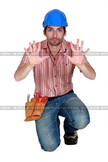 Tradesman holding up his hands. Стоковое фото, агентство Ingram Publishing / Фотобанк Лори