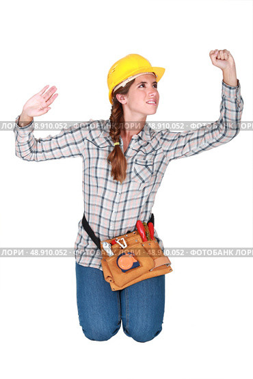Tradeswoman confined by a transparent wall. Стоковое фото, агентство Ingram Publishing / Фотобанк Лори