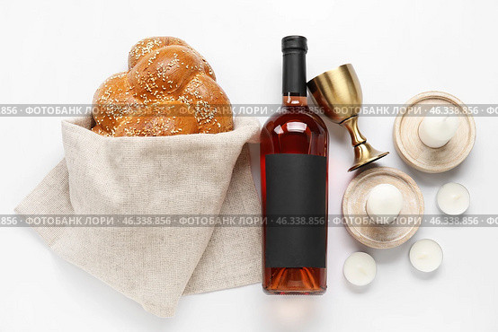Traditional challah bread with wine and candles on white background. Shabbat Shalom. Стоковое фото, фотограф Pixel_shot / Фотобанк Лори