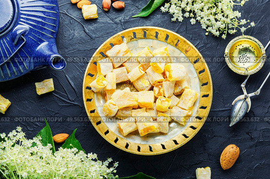 Traditional oriental sweetness, Turkish delight lokum with elderberry flavor.. Turkish rahat lokum. Стоковое фото, агентство Ingram Publishing / Фотобанк Лори