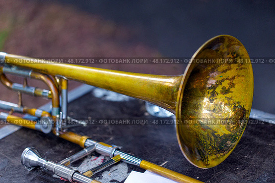 Trombone - fragment of wind brass orchestral musical instrument. Стоковое фото, фотограф Евгений Ткачёв / Фотобанк Лори