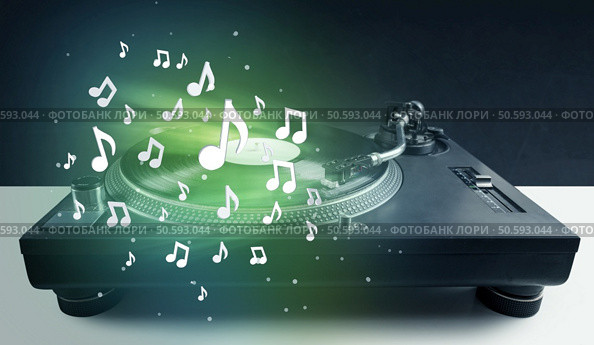 Turntable playing music with audio notes glowing concept on background. Стоковое фото, агентство Ingram Publishing / Фотобанк Лори