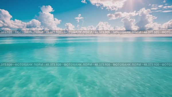 Turquoise waters reflect sunlight amidst a backdrop of fluffy clouds, creating a tranquil atmosphere perfect for relaxation and nature appreciation. Стоковое AI-видео, аниматор Данила Большаков / Фотобанк Лори