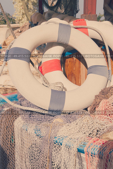two life buoy and marine net, retro toned. life buoy. Стоковое фото, агентство Ingram Publishing / Фотобанк Лори