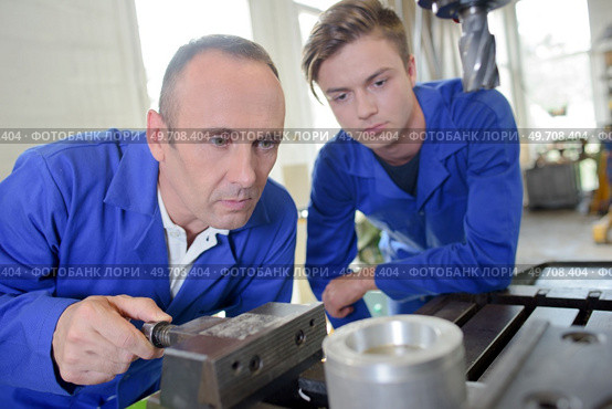 two men in the workshop. Стоковое фото, агентство Ingram Publishing / Фотобанк Лори