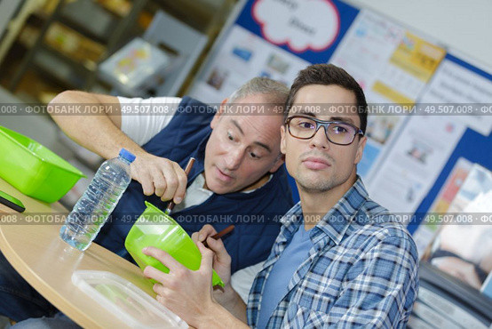 two worker in factory have a break. Стоковое фото, агентство Ingram Publishing / Фотобанк Лори