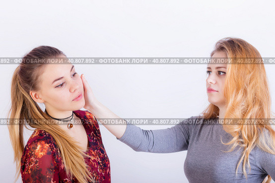 Two young woman fighting, a slapping in the face. Стоковое фото, фотограф Сергей Сергеев / Фотобанк Лори