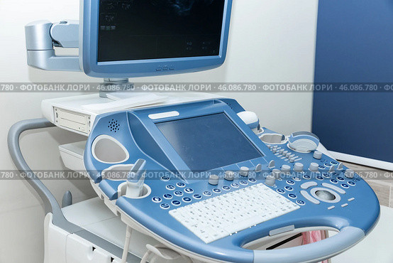 Ultrasound machine with sensor close-up. The sensor of the ultrasound machine in the doctor's office. Surgery clinical computer room. Advance ultrasound machine in hospital. High quality photo. Стоковое фото, фотограф Ирина Михайличенко / Фотобанк Лори