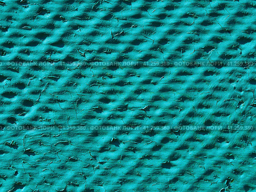 Uneven relief surface of green color with cracked paint. Abstract texture background. Close-up of a relief flat slate painted with green paint. Turquoise relief background. Стоковое фото, фотограф Александр Кротков / Фотобанк Лори