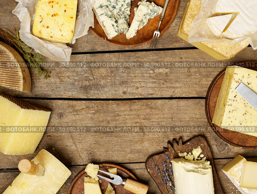 Various types of cheese on rustic background, with copy space. Стоковое фото, агентство Ingram Publishing / Фотобанк Лори