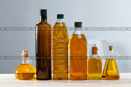 Vegetable oil on wooden table. Стоковое фото, фотограф Яков Филимонов / Фотобанк Лори