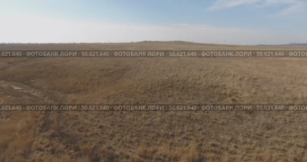 Video from a copter, nature of Crimea, fields, paths, lakes, water, trees, roads, summer, blue sky. Стоковое видео, видеограф Опока Алексей / Фотобанк Лори