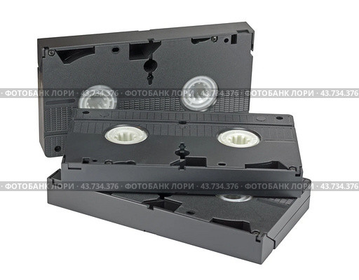 Видеокассеты формата VHS на белом фоне. VHS videotapes is isolated on a white background. Стоковое фото, фотограф Татьяна Д / Фотобанк Лори