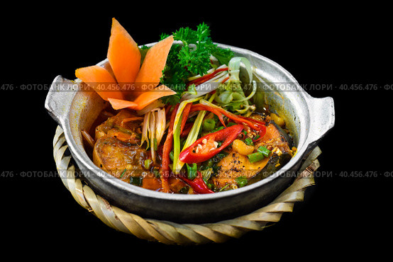 Vietnamese fried Mackerel fish with sauce on black background. Стоковое фото, фотограф Татьяна Терехина / Фотобанк Лори