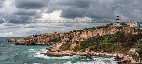 View of lighthouse at seashore against cloudy sky. Beautiful Lighthouse On The Rocks near Sile, Istanbul, Turkey, Black Sea. panorama. Стоковое фото, фотограф Павел Муравьев / Фотобанк Лори