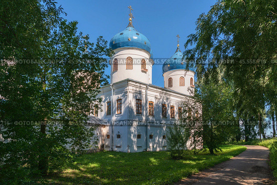 View of the Cross Exaltation Cathedral of St. George (Yuryev) Monastery on a sunny summer day, Veliky Novgorod, Russia. Стоковое фото, фотограф Ula Ulachka / Фотобанк Лори