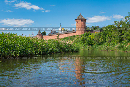 View of the Spaso-Evfimiev Monastery (a monastery of the Vladimir Diocese of the Russian Orthodox Church) on the bank of the Kamenka River on a sunny summer day, Suzdal, Vladimir region, Russia. Стоковое фото, фотограф Ula Ulachka / Фотобанк Лори