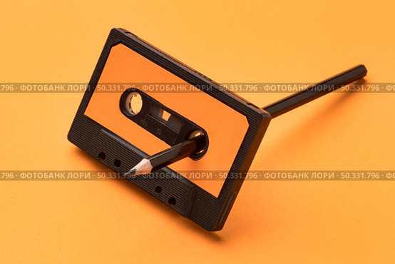 vintage cassette tape pencil magnetic recording film. High resolution photo. vintage cassette tape pencil magnetic recording film. High quality photo. Стоковое фото, агентство Ingram Publishing / Фотобанк Лори