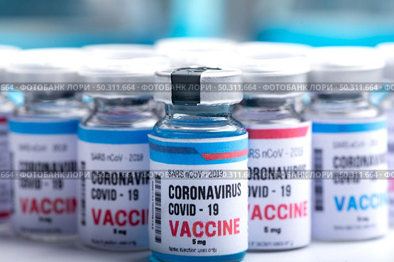 virus vaccine development of a coronavirus COVID-19, vaccine bottle in concept of insurance and fight against coronavirus 2019 ncov cure, medical research in laboratory to stop the spread of the virus. Стоковое фото, агентство Ingram Publishing / Фотобанк Лори