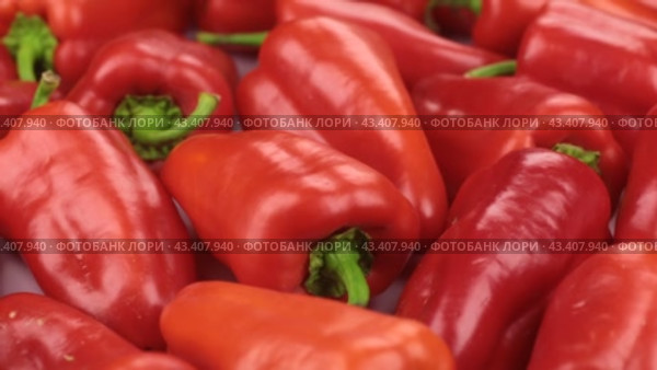 Вращение, горка спелого перца. Текстура перца. Растительный фон. Rotation, a heap of ripe pepper. Texture of peppers. Vegetable background. Стоковое видео, видеограф Александр Собко / Фотобанк Лори