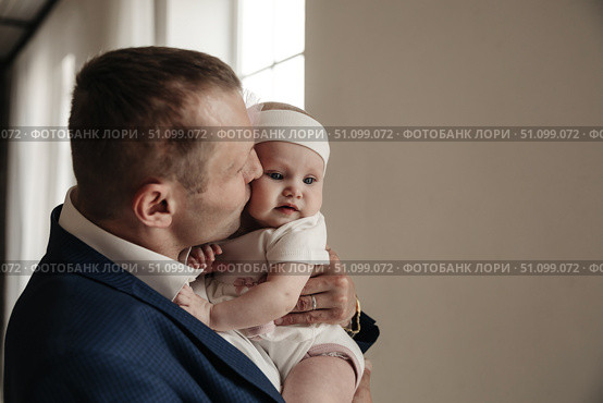 When Daddy's Little Girl Meets His Embrace, Precious Moments Unfold. Стоковое фото, фотограф Aleksandr Golubev / Фотобанк Лори