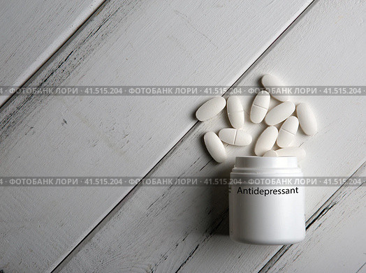 White pills with a jar with inscription antidepressant. Стоковое фото, фотограф Александр Калугин / Фотобанк Лори