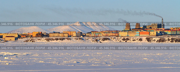 Winter panorama of the northern city of Anadyr. View of colorful buildings and thermal power plants. Anadyr is the easternmost city of Russia. Located on the banks of the Anadyr Estuary. Chukotka. Стоковое фото, фотограф Андрей Степанов / Фотобанк Лори