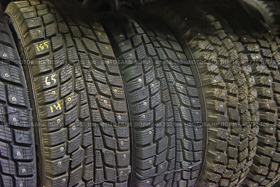 Winter studded tires in the shop. Стоковое фото, фотограф Анна Кривицкая / Фотобанк Лори