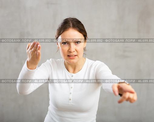 Woman argues while pointing accusingly with fury and anger. Стоковое фото, фотограф Яков Филимонов / Фотобанк Лори