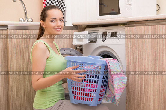Woman doing laundry at home. Стоковое фото, фотограф Elnur / Фотобанк Лори