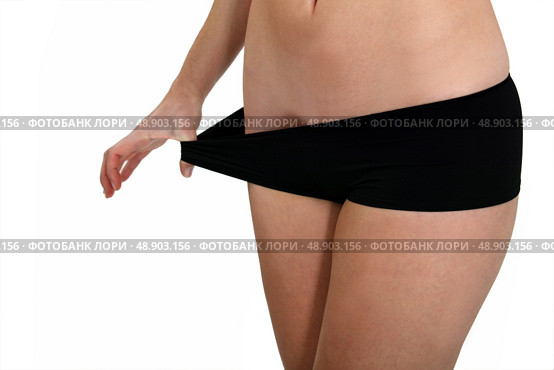 woman in black panties after losing weight. Стоковое фото, агентство Ingram Publishing / Фотобанк Лори