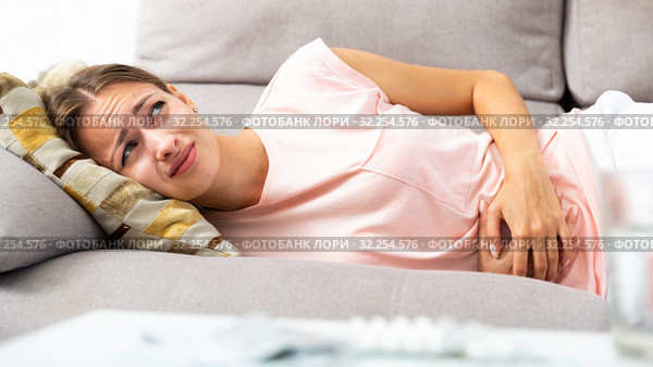 Woman suffering from abdominal pain. Стоковое фото, фотограф Яков Филимонов / Фотобанк Лори