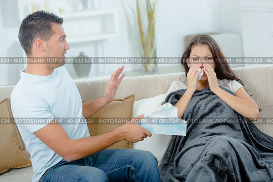 woman with colds covering her noise with a tissue. Стоковое фото, агентство Ingram Publishing / Фотобанк Лори